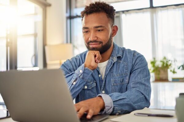 man sitting at laptop and thinking about getting brightspeed internet